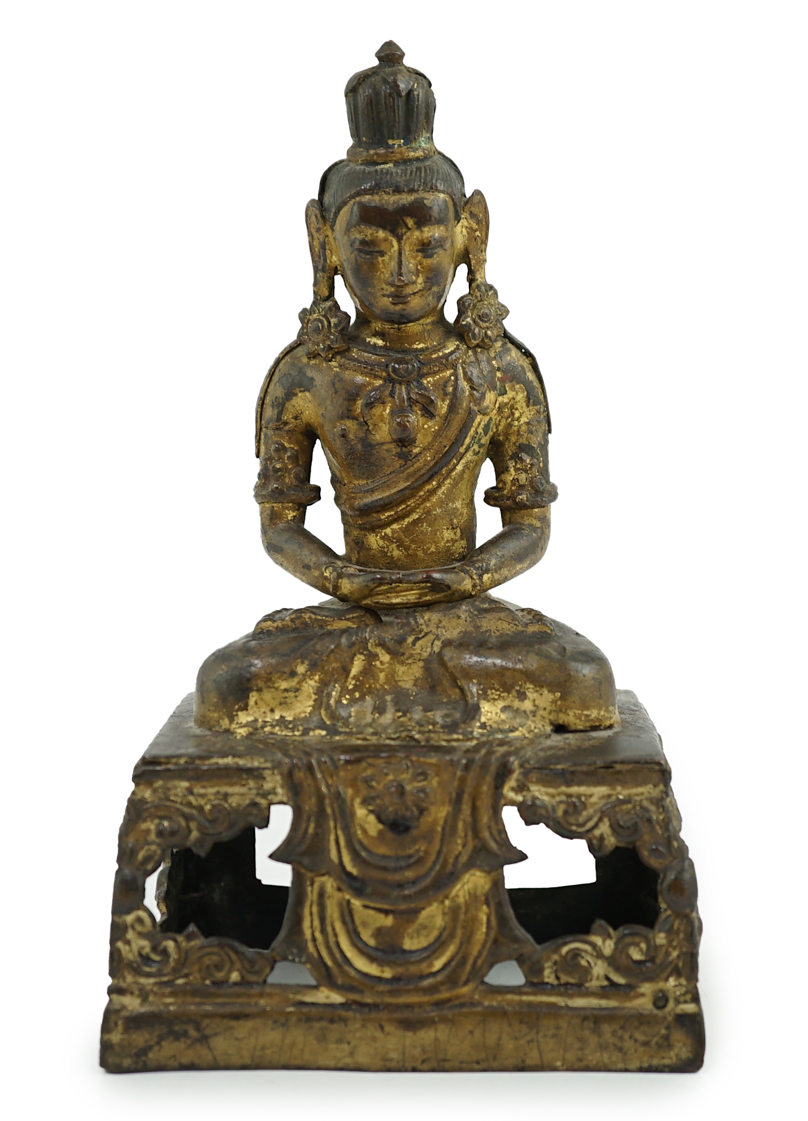 A Sino-Tibetan gilt repoussé copper alloy seated figure of Amitayus, Qianlong period, lacking aureole